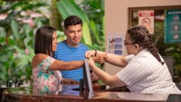 A couple check in at Ecotermales Hot Springs